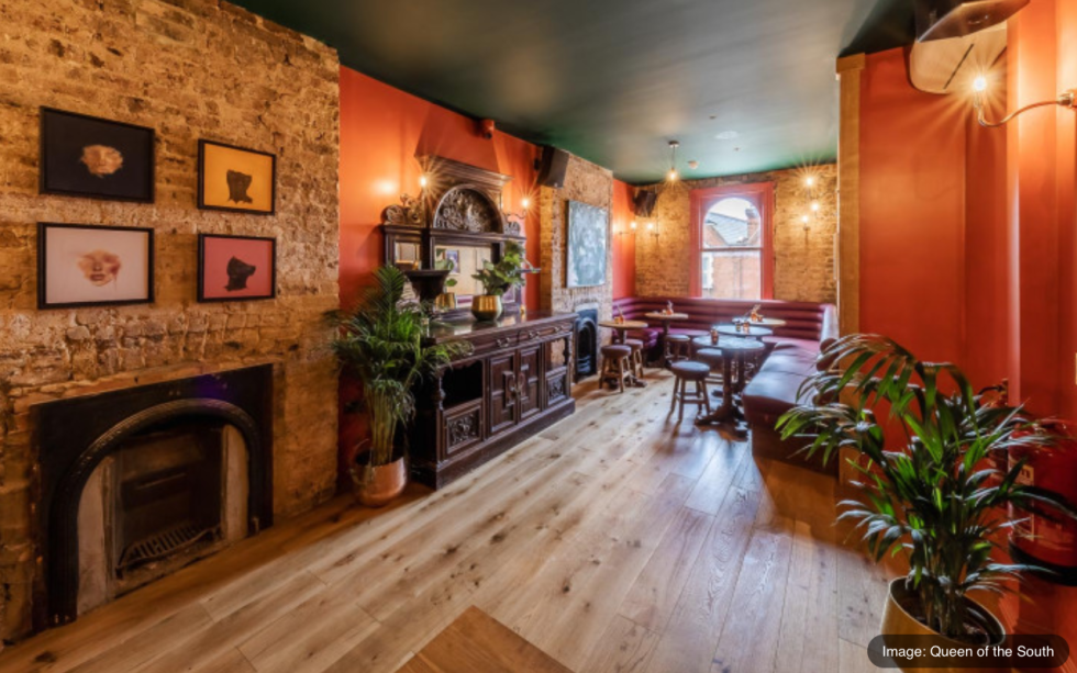 Queen of the South Pub: Where Community and Culture Collide - Black